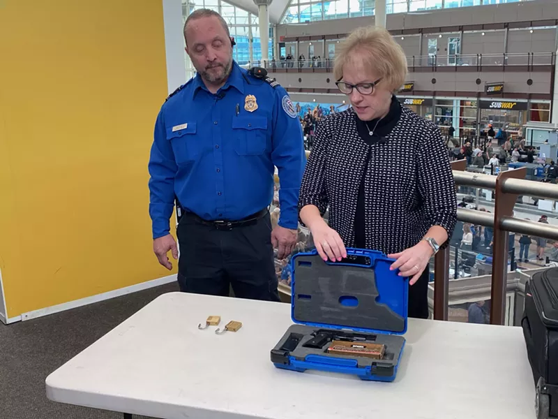 Image: Supervisory TSA Officer Richard Mendoza and spokesperson Lorie Dankers show the proper way to store firearms while traveling.