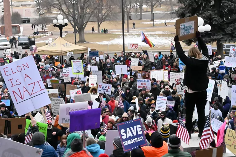 Image: Protesters stand at the capitol.