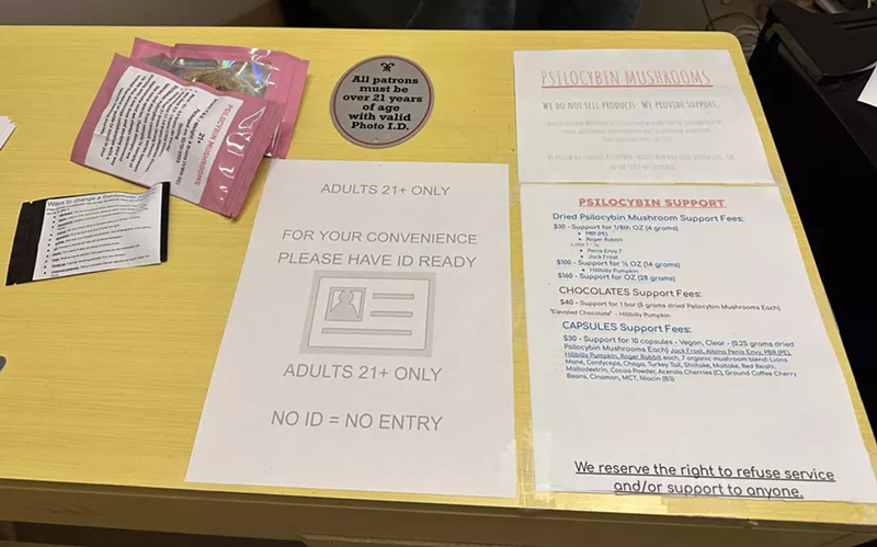 Image: A menu and front desk at a magic mushroom co-op in Denver.
