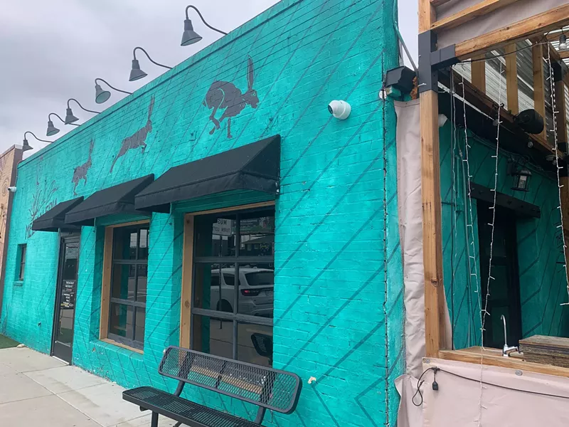 Image: exterior of a teal building