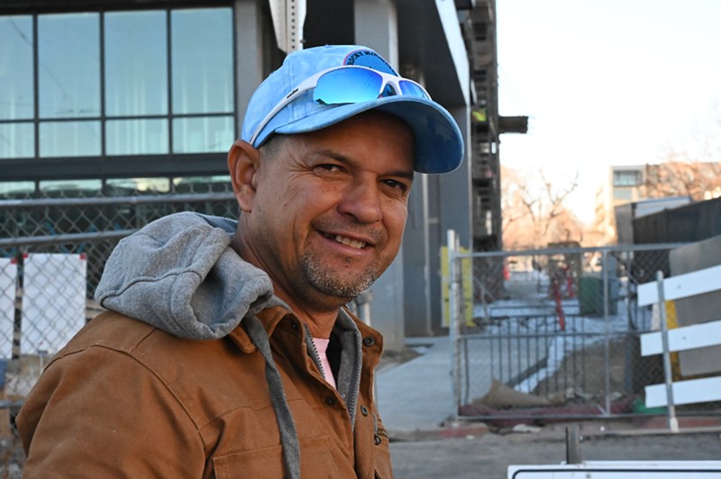 Hector Morales has temporary protected status, which has allowed him to work, but he still comes to the encampment on West 27th Avenue for his friends.