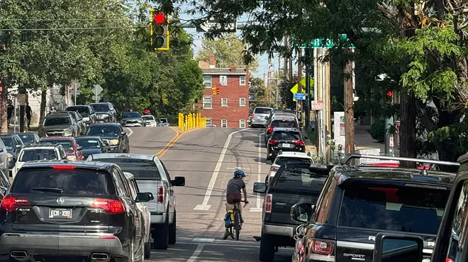A cyclist goes down 11th Avenue in Denver