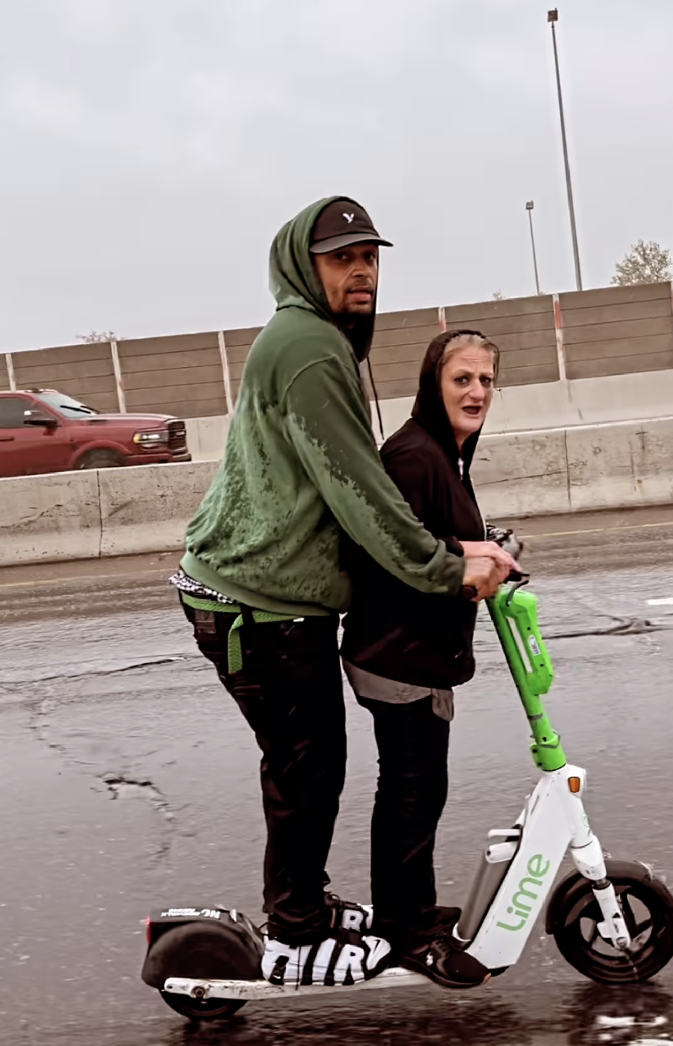 The Denver odd couple that was caught on video cruising along I-70 on a Lime scooter.