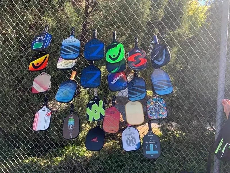Image: Picklers stack their paddles to reserve games at Congress Park.