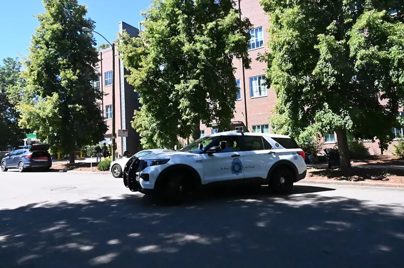 Image: A Denver Police officer pulls out from in front of The Gathering Place at 1535 North High Street.