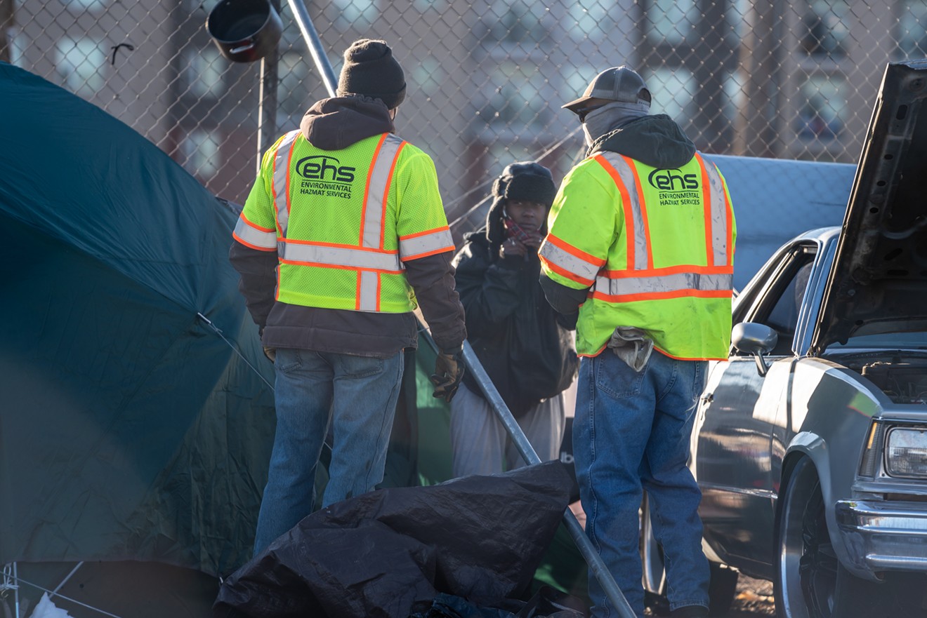 Clearing out a homeless encampment in Denver.