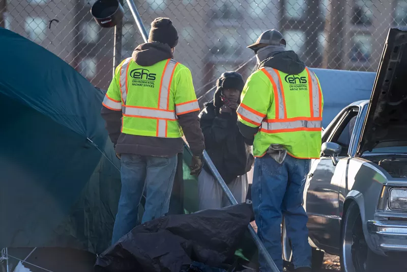 Image: Clearing out a homeless encampment in Denver.
