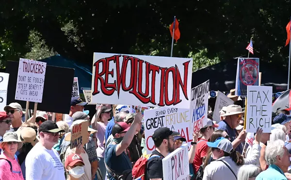 Image: Denver Protesters Hit Dog Days of Summer as Attendance Declines