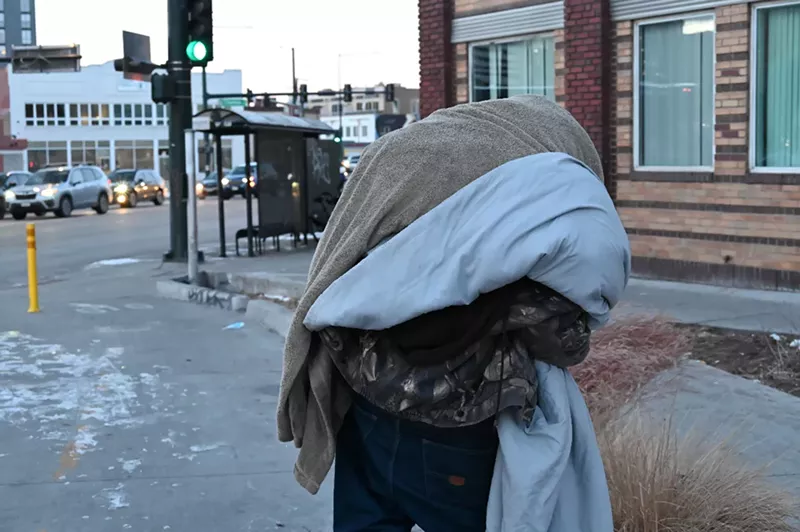 Image: Homeless resident Josh Rush looks for a place to get warm.