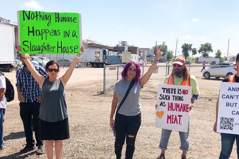 Advocates for Denver's proposed slaughterhouse ban picket outside of Superior Farms in Globeville.