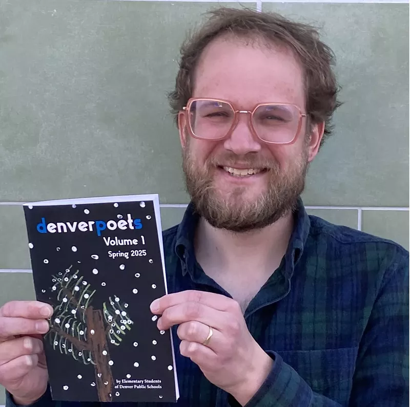 Image: A man holding a book