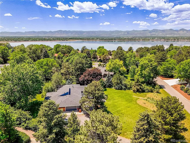 Image: A four-bedroom home on a 0.9-acre lot in view of a large lake in Bel Mar, Colorado.