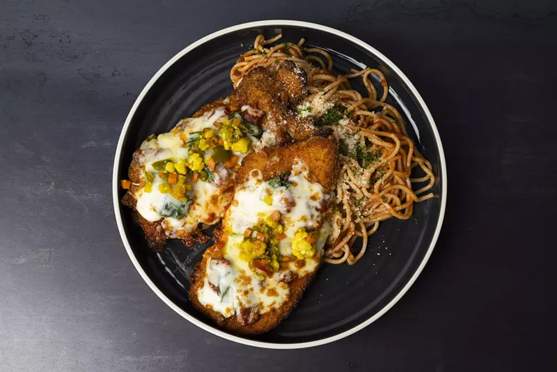 Image: chicken parm with pasta on a plate