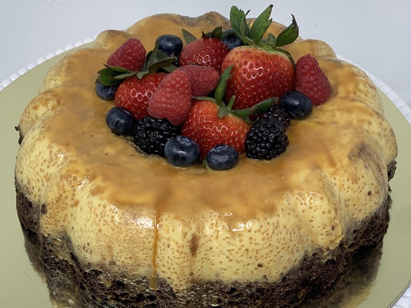 A flan cake topped with fresh berries is one of the recipes in Cocina Libre.
