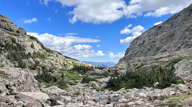 A boulder-strewn valley and distant peaks in Rocky Mountain National Park