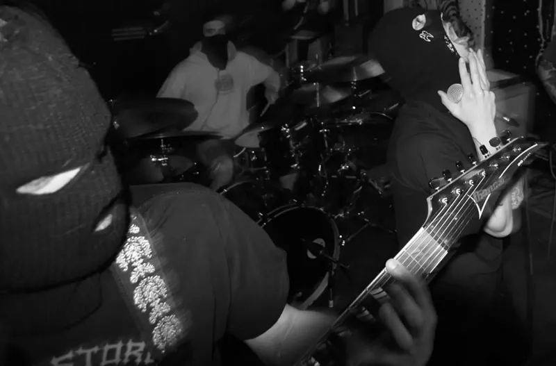 Image: DROP OUT may be mysteriously masked, but it hasn't stopped the Denver hardcore group from helping the community through benefit shows.