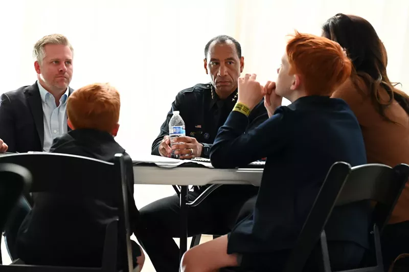 Image: A family talks to the police chief.