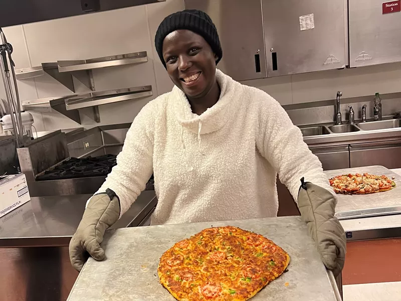 Image: Refugee participants gain more than just kitchen skills from this program.