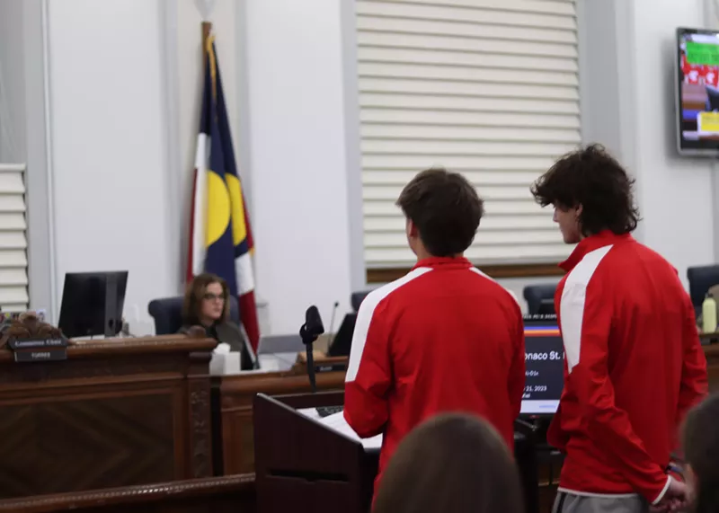 Image: Two East High School students, junior Mateo Tullar, left, and senior Zeke Lubin, talk to Denver City Council about gun control and student safety.
