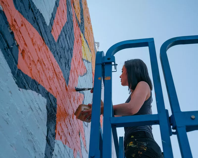 Image: The Obanoth, painting at the Matchbox during Art RiNo.