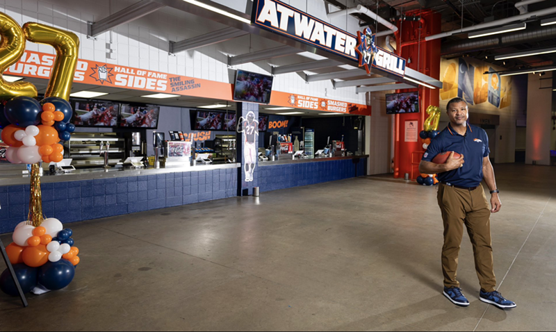 Image: football player in front of food counter