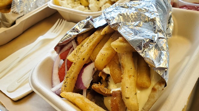 a gyro with fries inside