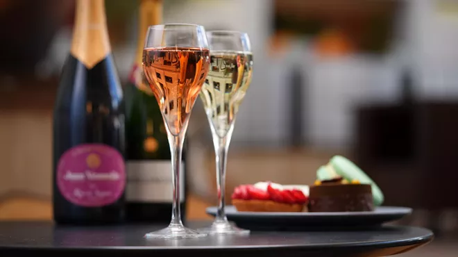 two glasses of champagne and pastries