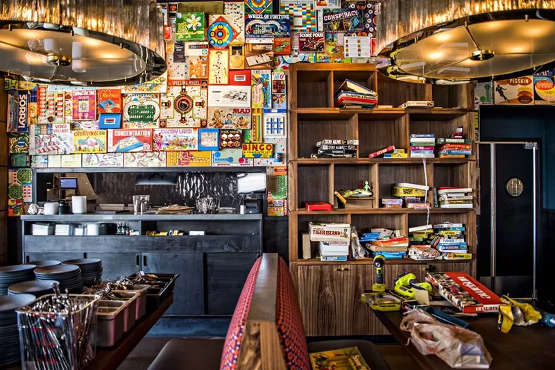 Image: The new Postino in Highlands Ranch has a wall installation made of games.