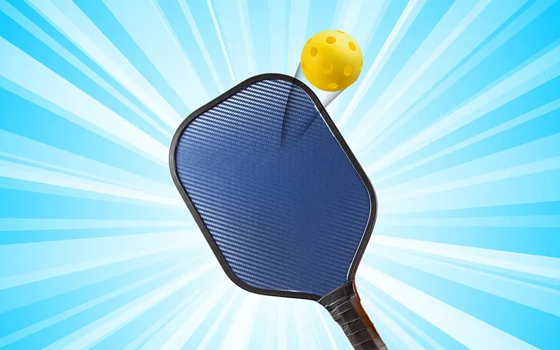 Image: pickleball paddle with ball