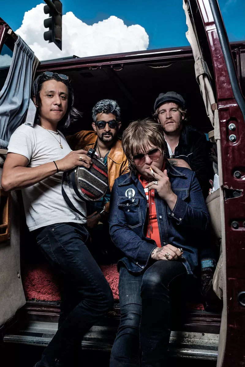 Image: band poses for photo
