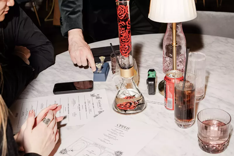 Image: Guests overviewing the cannabis menu at Cirrus Social Club