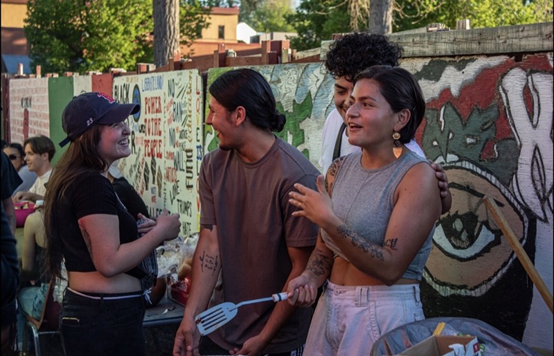 Enrique Benavidez (center) created the first Chicano Awareness Week at UNC.