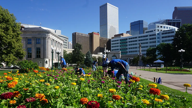 people caring for flower beds in Denver park