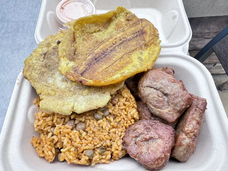 Image: tostones, rice and meat in a to-go box