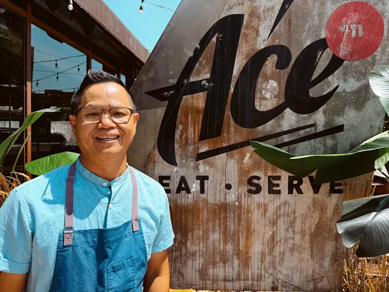 Image: man in a blue shirt and blue apron