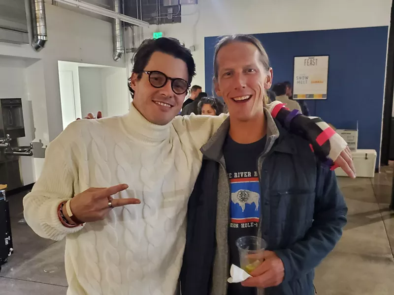 Image: Two men posing and smiling