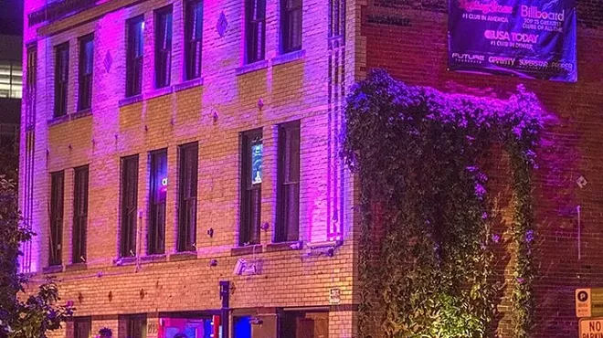 People wait in line at a nightclub
