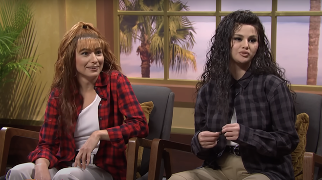 Two women sit next to each other