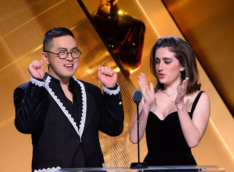 Image: man and woman announcing awards