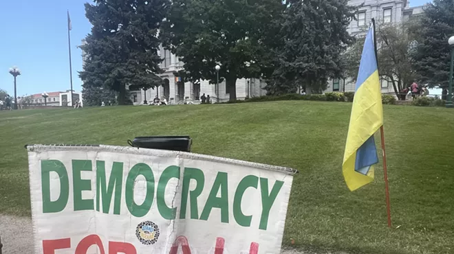 Democracy for all sign at Denver protest