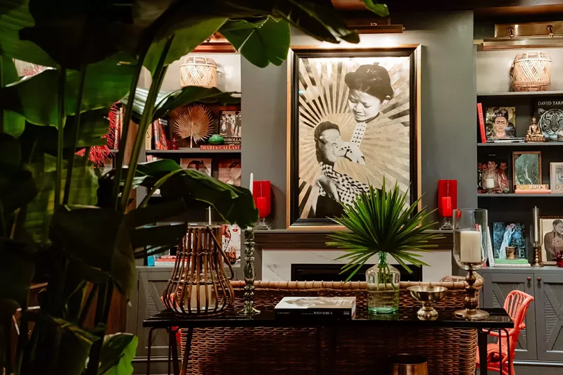 Image: restaurant with tropical plants and art