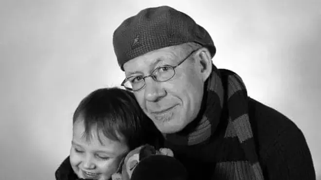 man in beret with boy