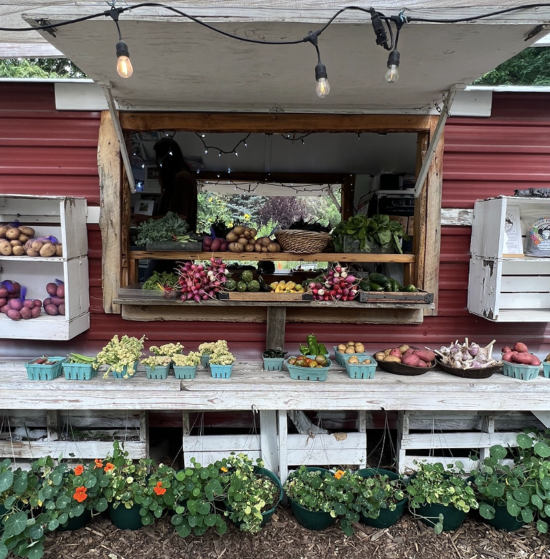 Image: A farm stand with fruits and vegetables
