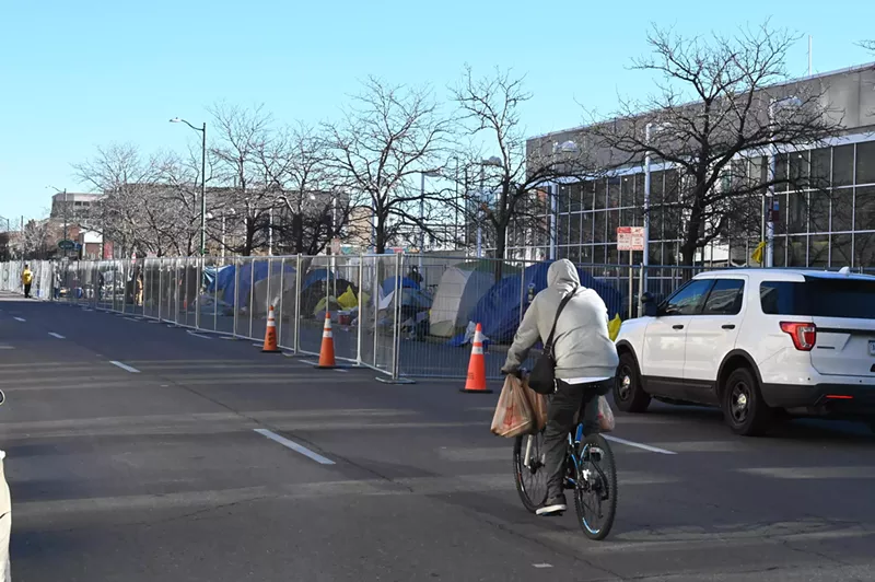 Image: man in sweatshirt on bike