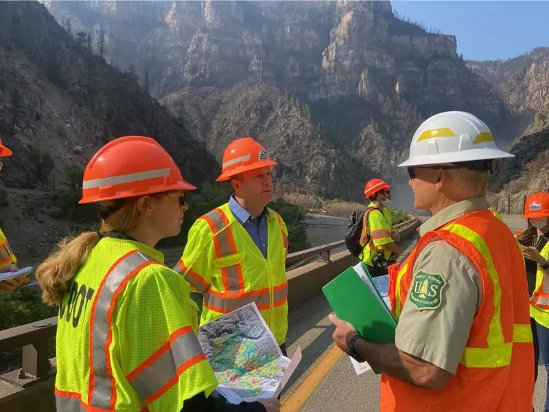 Image: Shoshana Lew and Jared Polis in Glenwood Canyon August 11.