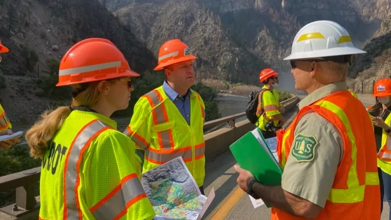 Image: Governor Jared Polis toured Glenwood Canyon early on August 11.