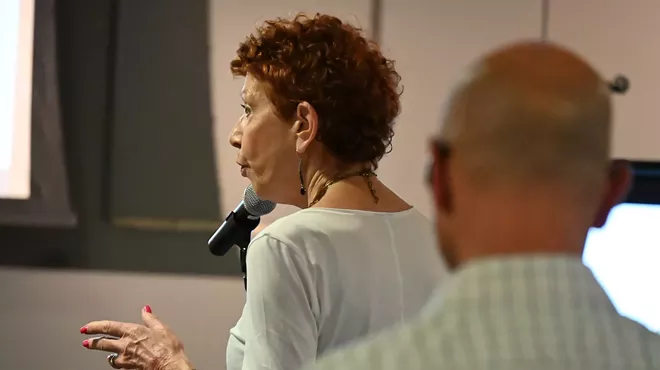 A Golden Triangle resident speaks at a community meeting.