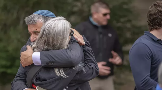 man and woman hug