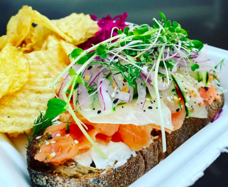 Image: open-faced sandwich with cream cheese and smoked salmon.