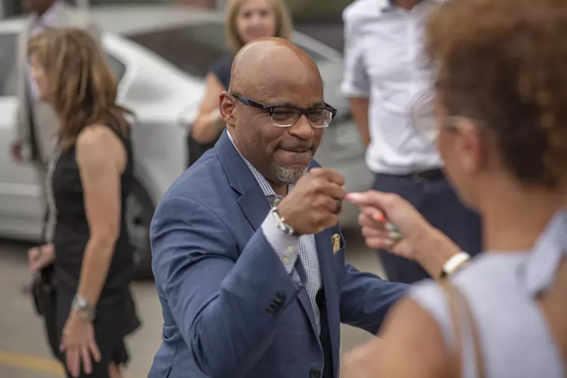 Image: Denver Mayor Michael Hancock celebrates during a public event